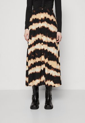 Black and beige tie-dye midi skirt with a button front design and a flared silhouette, paired with black ankle boots. Smooth fabric texture.