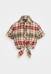 Cropped, short-sleeve plaid shirt in red, yellow, green, and cream. Features a collar and front tie closure with button detail. Cotton material.