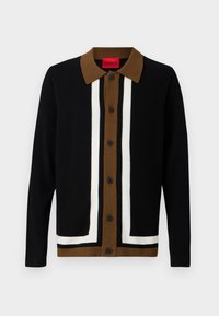 Svart cardigan med ett brunt och vitt randigt mönster, med krage, knäppning fram och textil med struktur.