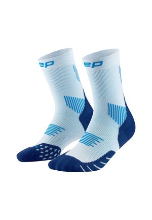Compression socks in light blue and navy, featuring a breathable knit, textured patterns, and reinforced toe and heel sections.
