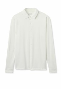 Witte lange mouwen shirt van zachte stof, met een knoopsluiting aan de voorkant en een klassieke kraag. Glad van textuur, met knoopaccenten.