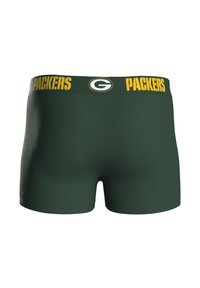 Zelené boxerky s žlutým pasem s nápisem „PACKERS“ a logem. Hladká, elastická látka s přiléhavým střihem.
