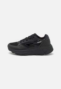 Black athletic shoes with a textured leather and mesh upper, padded collar, lace-up design, and a thick rubber sole featuring grooves.