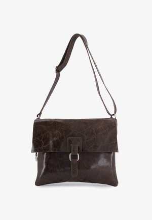 Brown leather crossbody bag with a folded flap, metallic buckle detail, and adjustable strap. Smooth texture with a subtle sheen.