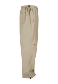 Pantalons cargo beige avec une taille élastique, des poches latérales et des poignets ajustables. Fabriqués en tissu léger avec une texture lisse.