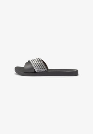 Black slide sandal with thick gray braided strap and flat sole, side view on a white background.