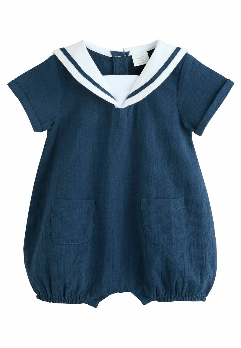 Barboteuse bébé bleu marine à manches courtes, col marin blanc avec rayures bleu marine, deux poches avant et bas des jambes élastiqués.