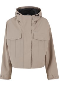 Beige cropped jas met capuchon, voorzakken met klep, lange mouwen, verstelbare manchetten en rits bedekt door een geknoopte beleg.