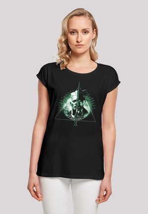 Black short-sleeve t-shirt featuring a green graphic design of two faces in a triangular shape with radiating details.
