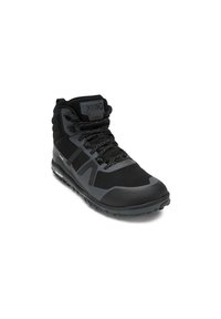 Scarpa nera alta con tessuto texture, suola in gomma decorata e occhielli rinforzati. Caratterizzata da logo sulla linguetta e lacci resistenti.