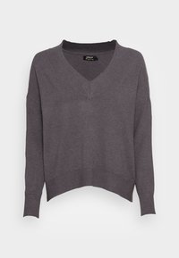 Dunkelgrauer V-Ausschnitt, cropped Pullover aus weichem Strickmaterial. Verfügt über lange Ärmel und gerippte Bündchen. Leichtgewichtig mit minimalistischen Design.