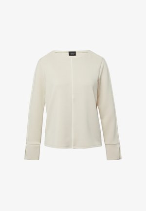 Haut crème à manches longues avec un col rond, doté d'une couture centrale et de poignets pliés. Confectionné dans un tissu doux et lisse.