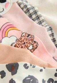Five pairs of colorful socks, featuring patterns: leopard print, rainbow, light pink, and black plaid. Soft cotton material, varied textures.