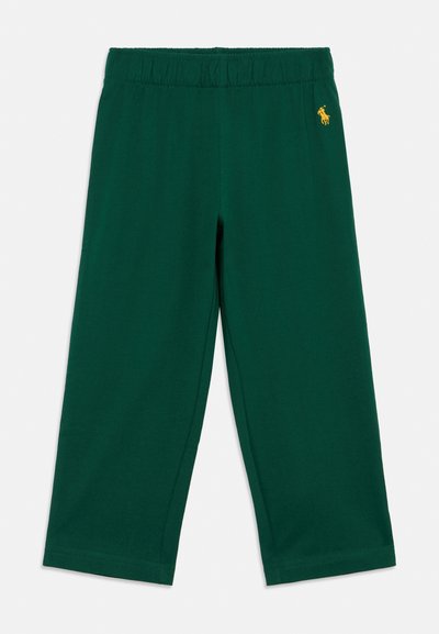 Grüne Baumwollhose mit elastischem Bund, cropped Länge und einem kleinen gelben Logo auf der linken Seite. Glattes, lässiges Design.