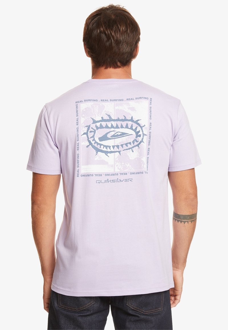 Light purple cotton t-shirt featuring a graphic design on the back with blue text and logo, short sleeves, and a relaxed fit.