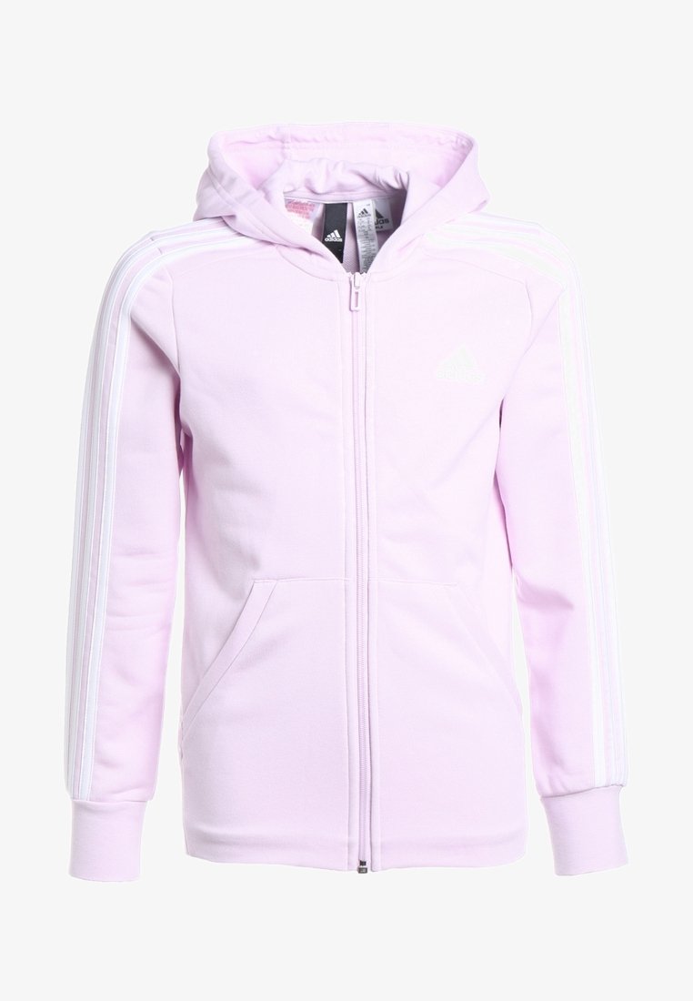 Haut de survêtement zippé rose pâle avec une capuche, bandes blanches sur les manches et poches avant. Fabriqué en tissu doux et texturé.