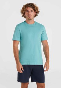 SMALL LOGO - Sports T-shirt - ripling shores