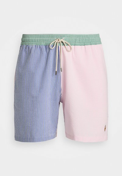 Plave prugaste kupaće hlače s plavo-bijelim kvadratnim uzorkom s jedne strane i ružičastom teksturiranom stranom. Elastična gumica u struku s vezicom i logotipom.