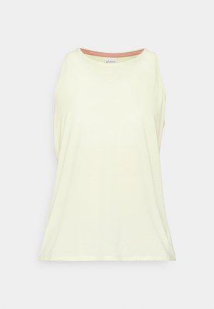 Svijetložuti bezrukavni top izrađen od mekanog materijala. Okrugli izrez s kontrastnim unutarnjim rubom. Opusti fit s bočnim prorezima.