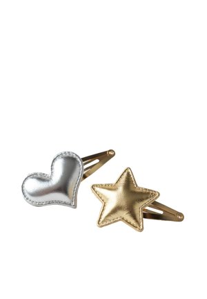 Two metallic hair clips with fabric shapes: one silver heart and one gold star on gold-colored metal bases.