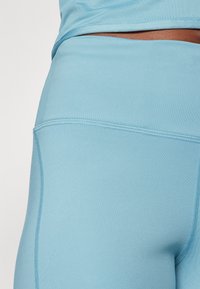 Nike Performance FAST - Leggings da corsa lunghi - denim turquoise/silver