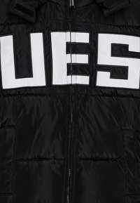 Guess JUNIOR HHOODED PADDED - Vinterjakke - jet black a996
