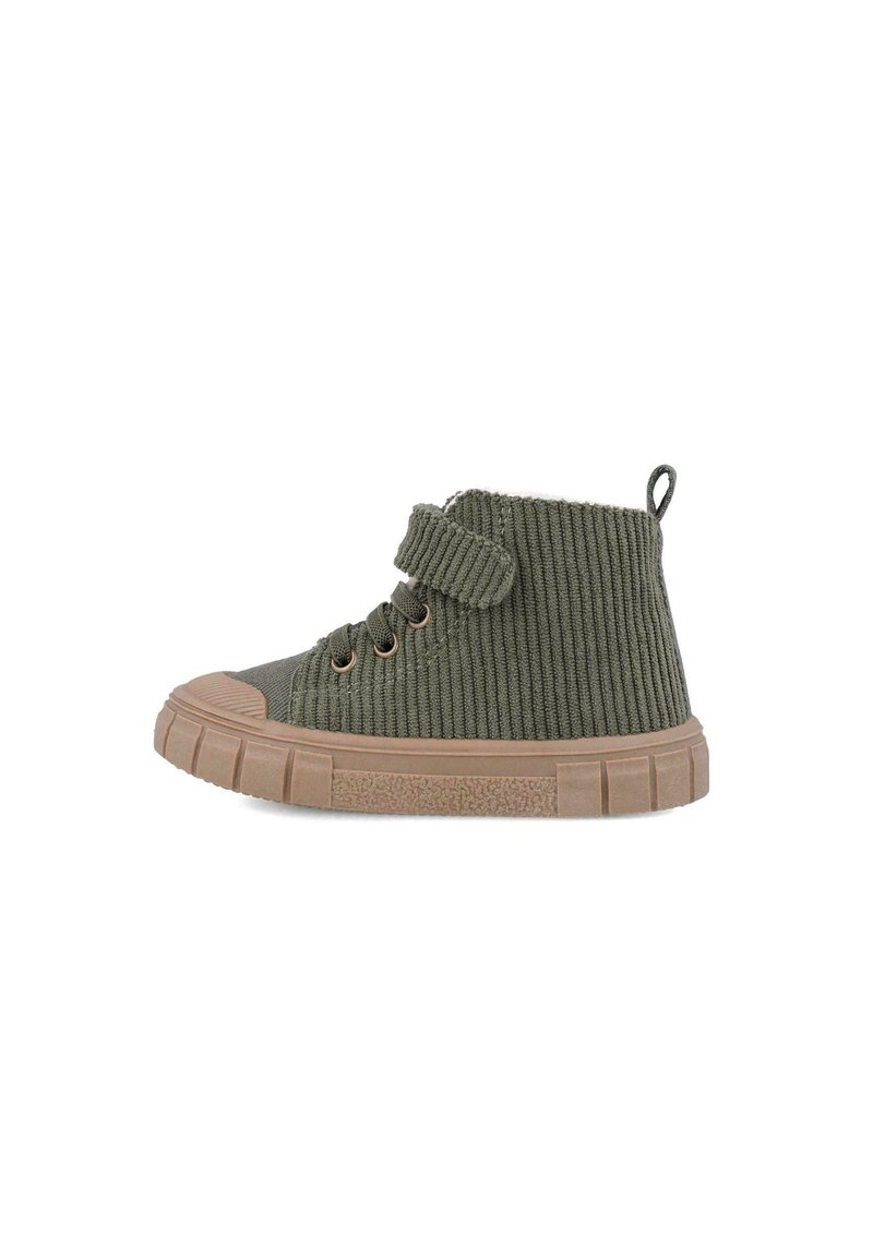 Stivale alla caviglia in corduroy verde con superficie texturizzata, suola in gomma, due occhielli per i lacci e una fascia in velcro per la chiusura.