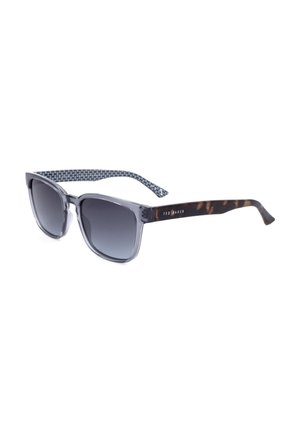 Occhiali da sole con lenti quadrate grigie, lenti sfumate scure, aste in tartaruga e dettagli interni decorati, marchiati Ted Baker sul lato.