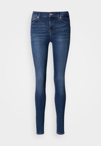 Sötétkék farmerből készült skinny fit farmernadrág, középmagas derékkal, öt zsebes kialakítással, és finom kopott hatással az elülső és hátsó részen.