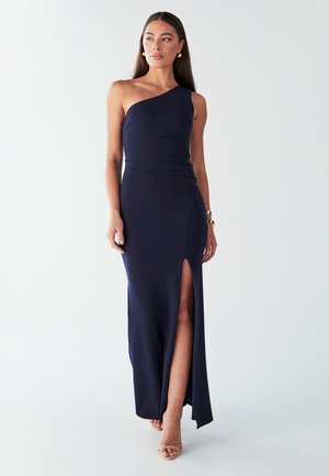 Navy blue one-shoulder maxi dress in smooth fabric, featuring a side slit and fitted design. Minimalistic with a clean silhouette and elegant accents.