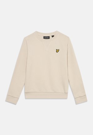 Beige lange mouw crewneck trui met een klein geel en zwart vogel logo op de linkerborst en geribbelde manchetten en zoom.