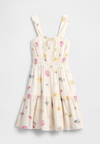 Vestido bege claro com alças finas, corpete franzido, saia em camadas e estampas coloridas de conchas e sol. Feito de tecido macio com um corte descontraído.