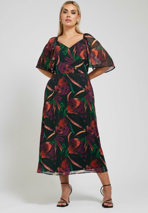 Bloemenmaxi-jurk van lichtgewicht, doorschijnende stof met levendige rode, groene en paarse patronen, met bell sleeves en een V-hals.