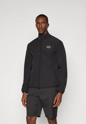 Black zip-up jacket with a stand collar, made of lightweight material. Features an embroidered EA7 logo on the chest, with elastic cuffs.