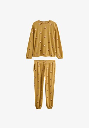 Yellow pajama set featuring a crewneck long-sleeve top and elastic waistband pants, adorned with a repeated fox pattern. Soft fabric texture.