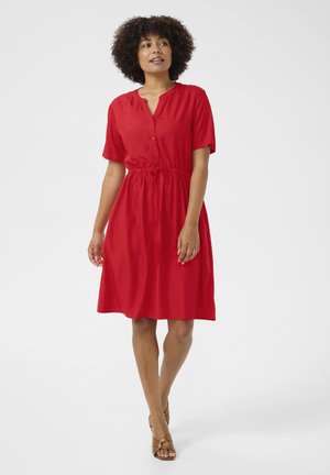 Red dress made of smooth fabric, featuring short sleeves, a button-down front, and an elastic waistband for shape. Simple design, knee-length.