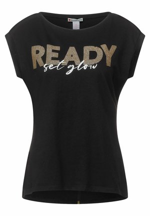 Sort kortærmet t-shirt med løs pasform, prydet med metallisk guld- og hvid tekst: "READY set glow". Blødt bomuldsstof, rund halsudskæring.