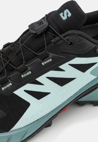 Salomon SUPERCROSS 4 GTX - Sapatilhas de trail running - black/trellis/yucca