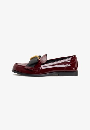 Burgundy patent leather loafer with a black ribbon accent and gold buckle, featuring a sleek shape and low black rubber sole.