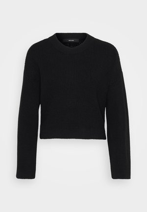 Pull court noir en tissu tricoté. Il présente un col rond, des manches longues et une surface texturée avec un ajustement serré à l'ourlet.