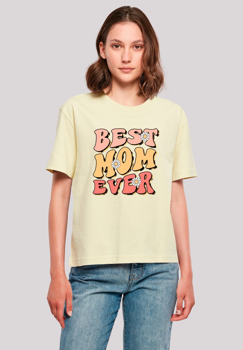 Light yellow, short-sleeved t-shirt featuring the text “BEST MOM EVER” in bold, colorful fonts with floral accents. Casual fit.