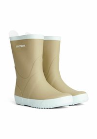 Beige gummistøvler med hvide såler og detaljerne, der har en glat overflade og en rund tå. Tretorn-logoet er trykt på siden.