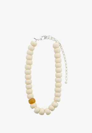 Helmed kaelakee valgetest keraamikapärlitest ja ühe mürtsuva merevaigukristallpärliga. Omab hõbedast ahelat ja lukku.