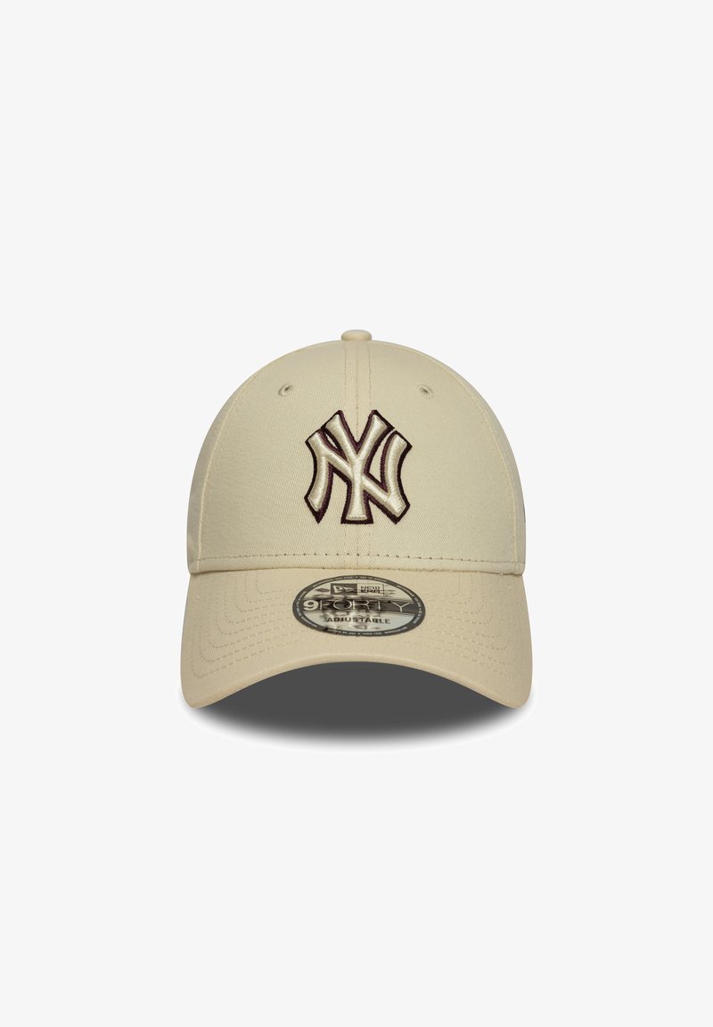 Beige cap made of fabric, featuring a raised dark brown NY logo on the front, adjustable strap at the back, and a rounded peak design.