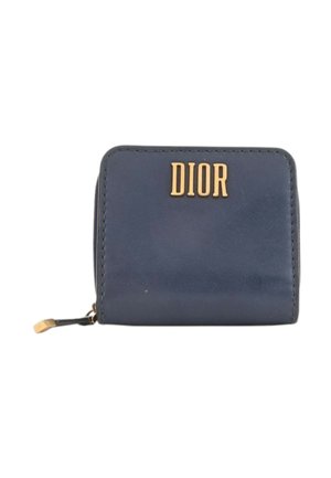 Portefeuille compact en cuir bleu marine avec logo DIOR doré et fermeture éclair avec tirette dorée et noire.