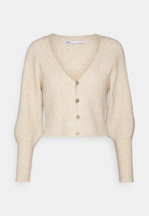 Beige neulejakku, jossa on V-pääntie, lyhyt malli ja pitkät puffihihat. Edessä neljä kultasävyistä nappia ja ribbikuviointi.