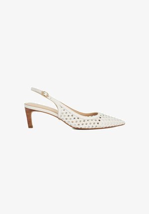 White slingback shoe with perforated design, pointed toe, low block heel, and adjustable strap featuring a gold buckle accent.