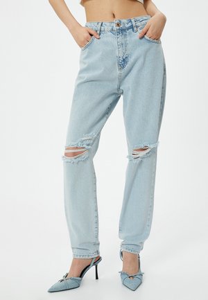 Lichtblauwe, versleten, hoge taille jeans met scheuren op de knieën. Gemaakt van denim, met een relaxte fit en taps toelopende pijpen.