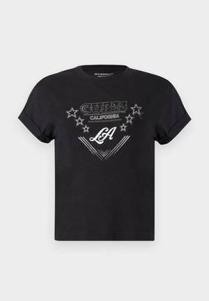 T-shirt noir à manches courtes en coton avec un motif graphique affichant "GUESS CALIFORNIA" et "LA" en blanc avec des accents d'étoiles.