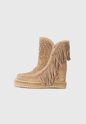 Botas para la nieve - crosta